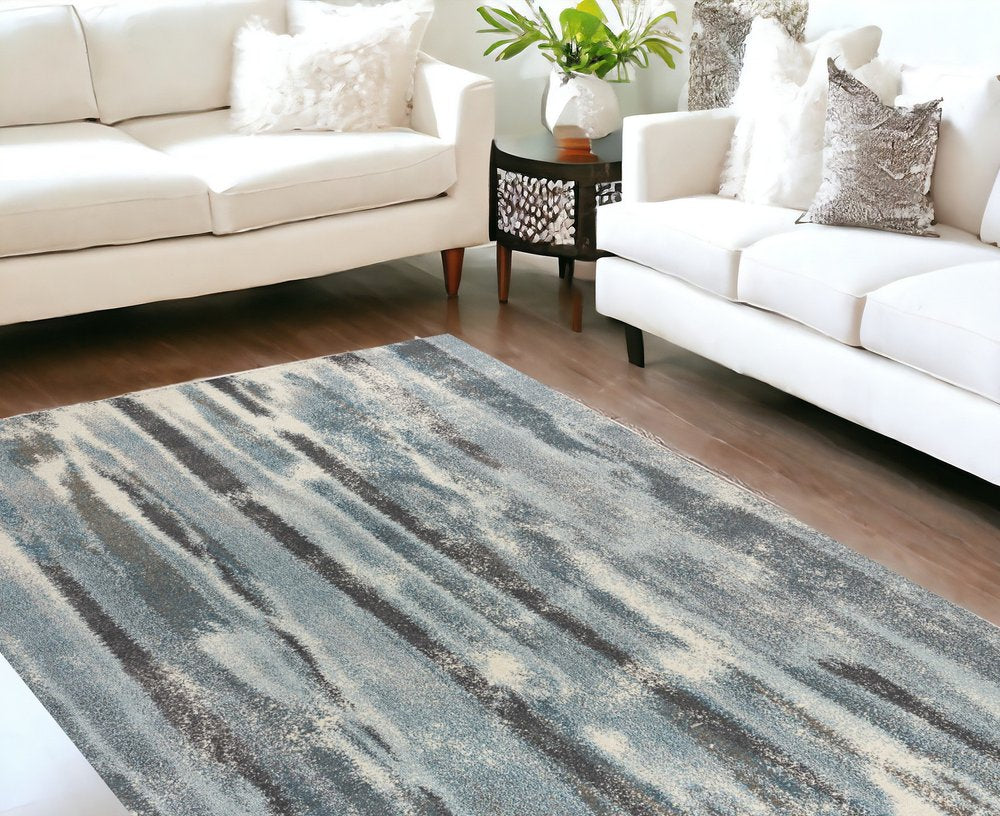 7' X 10' Teal Blue And White Abstract Distressed Area Rug