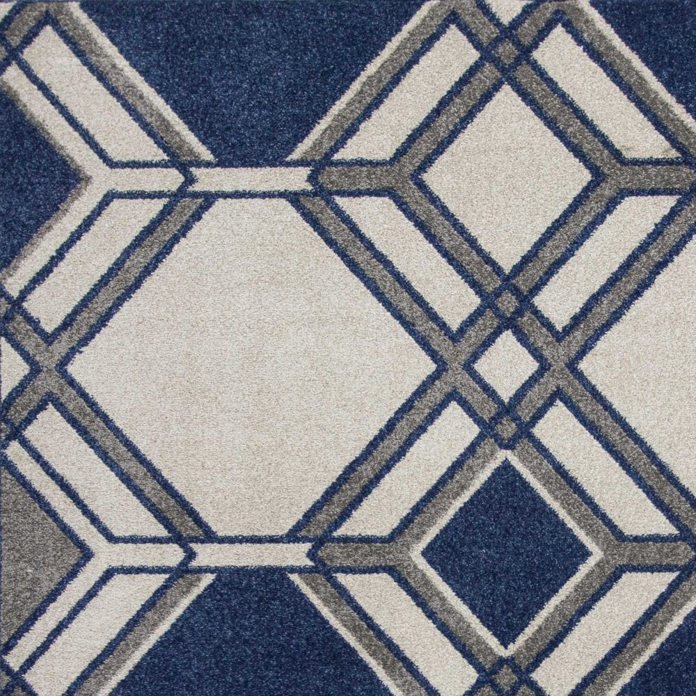 5' X 8' Blue Ivory And Gray Geometric Area Rug