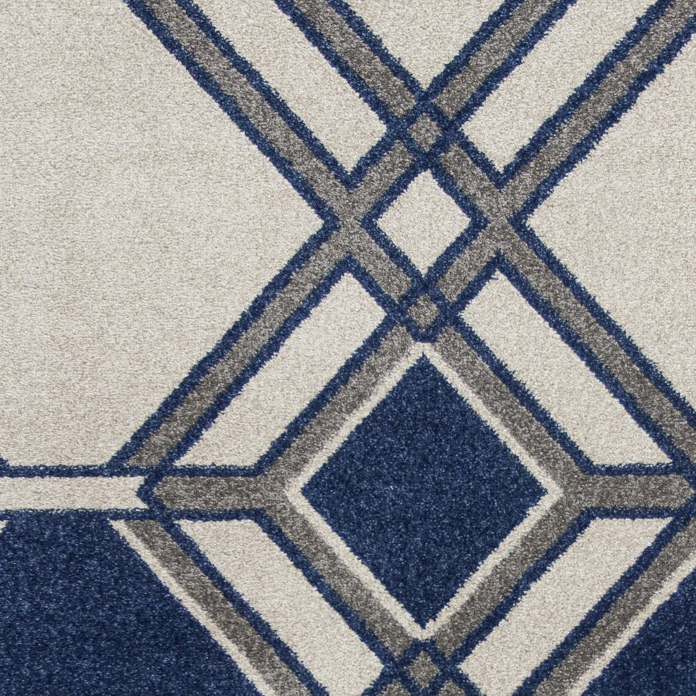 5' X 8' Blue Ivory And Gray Geometric Area Rug