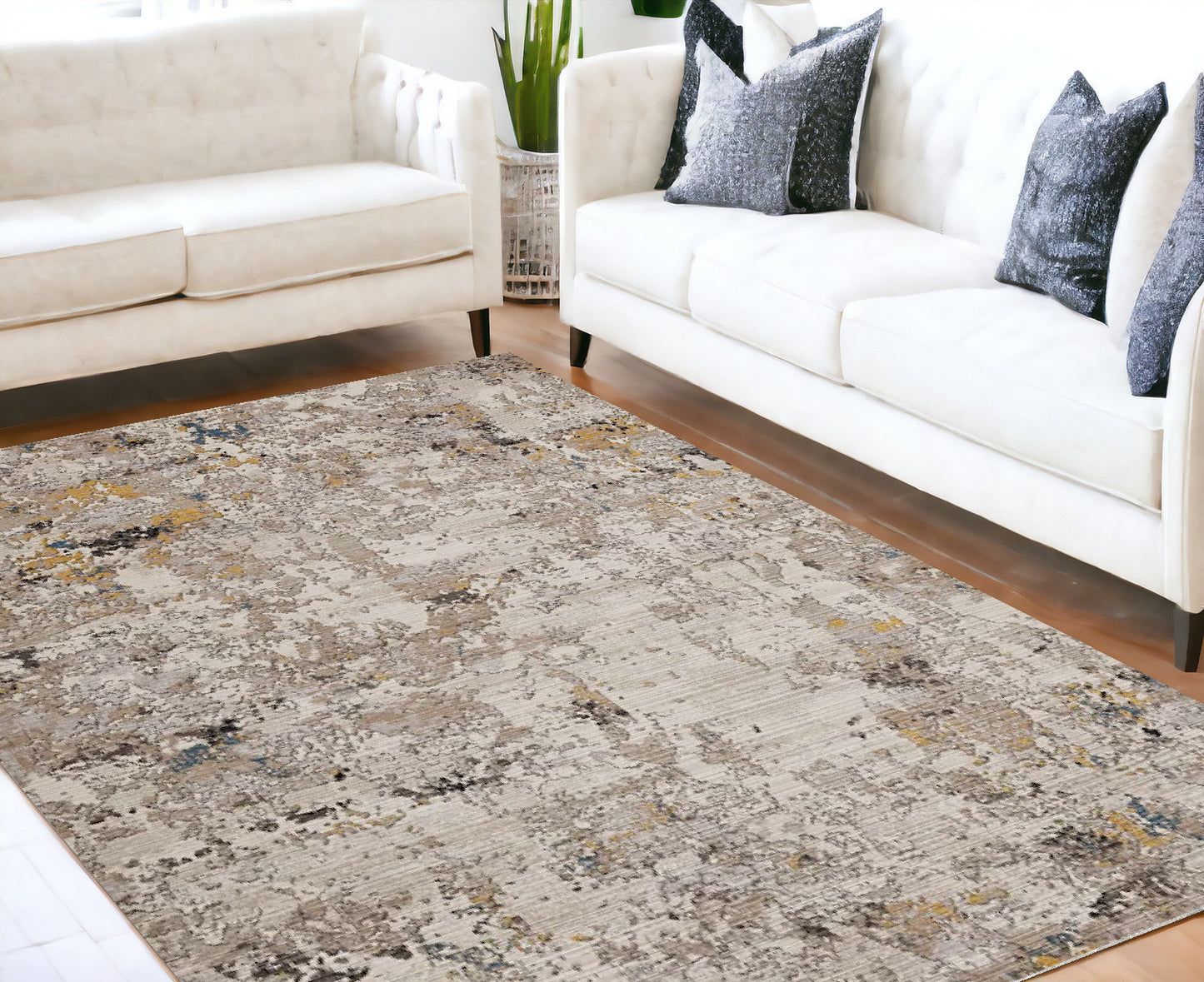 5' X 7' Beige Tan And Gold Abstract Hand Loomed Distressed Area Rug