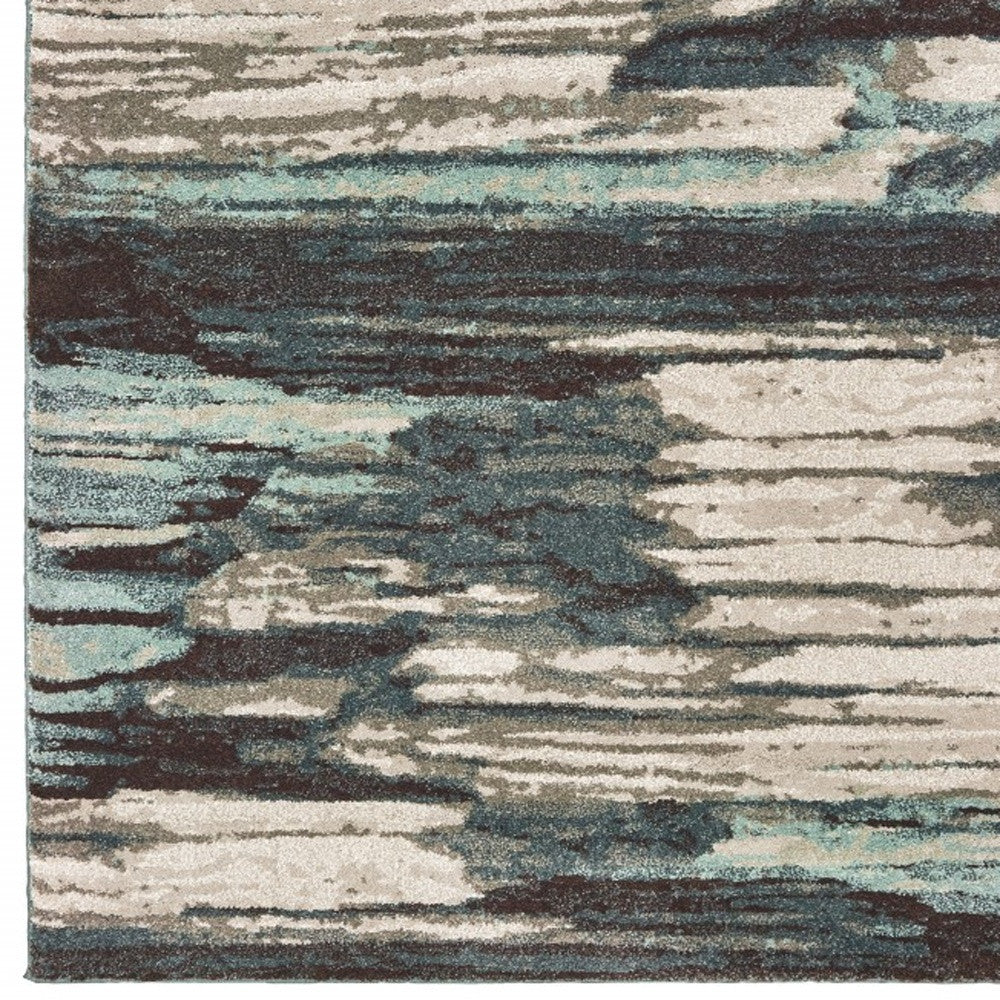 6' X 9' Ivory Blue And Gray Abstract Area Rug