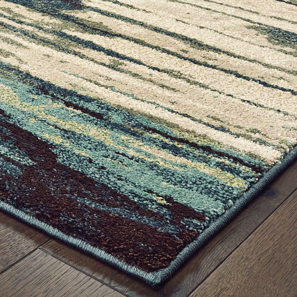 6' X 9' Ivory Blue And Gray Abstract Area Rug