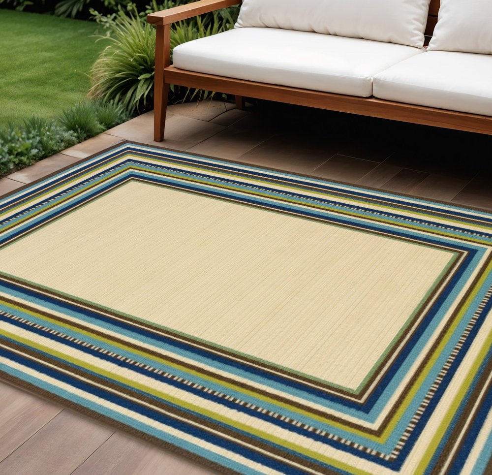 8' X 13' Ivory And Blue Striped Indoor Outdoor Area Rug