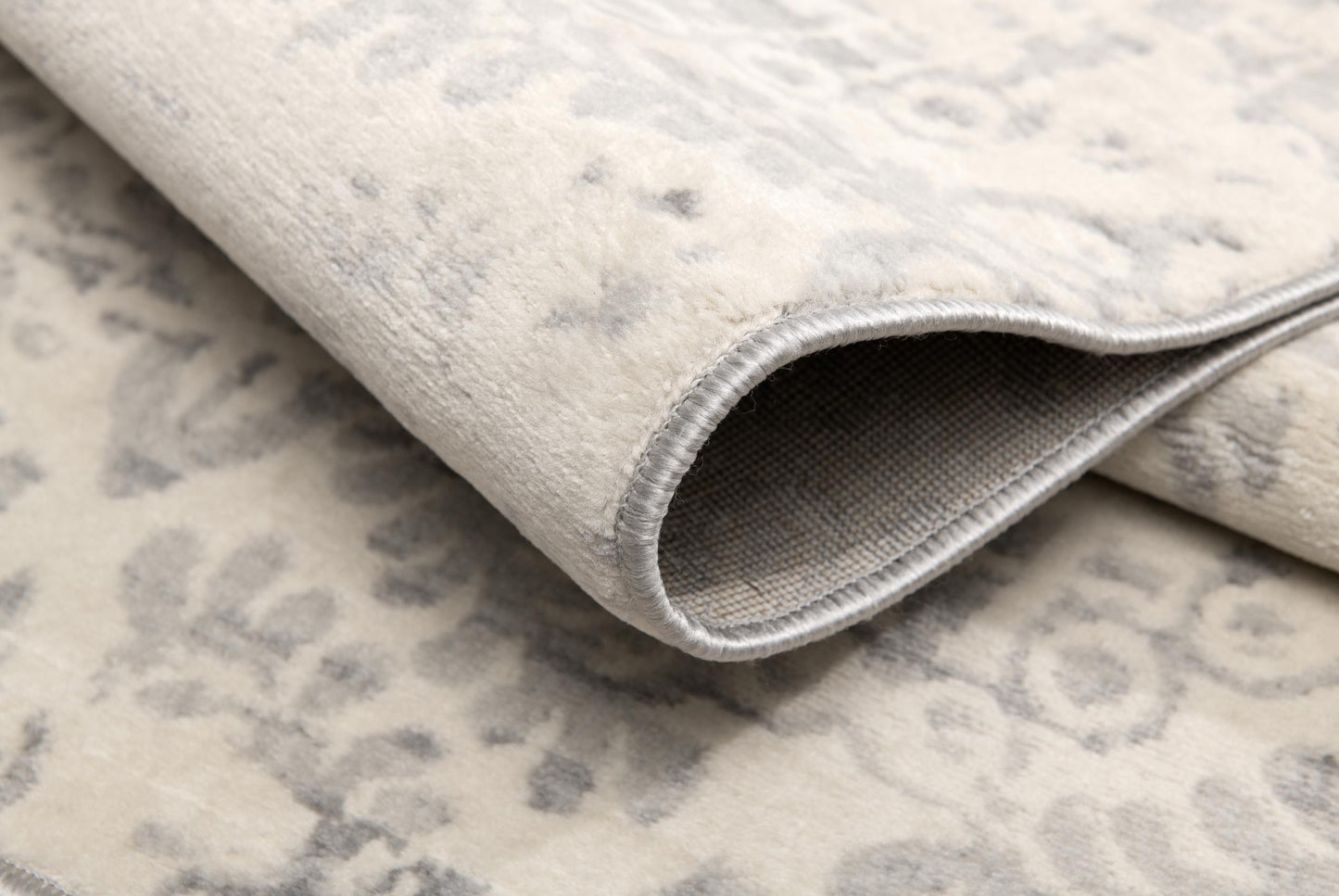 2' X 5' Ivory and Gray Ikat Power Loom Distressed Area Rug