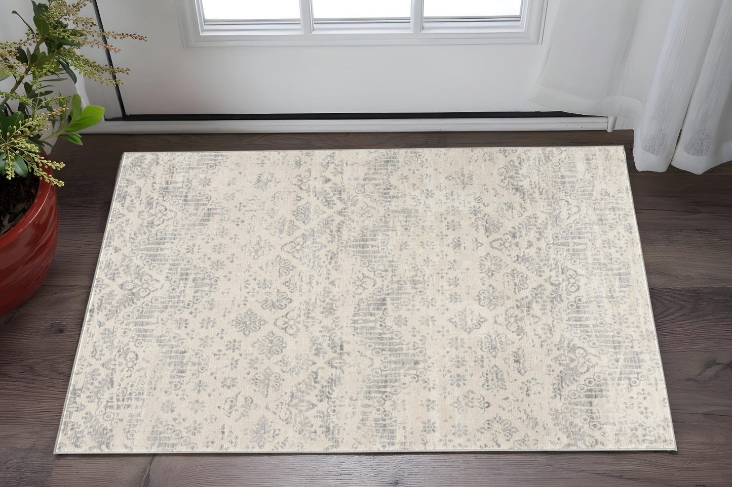 2' X 5' Ivory and Gray Ikat Power Loom Distressed Area Rug