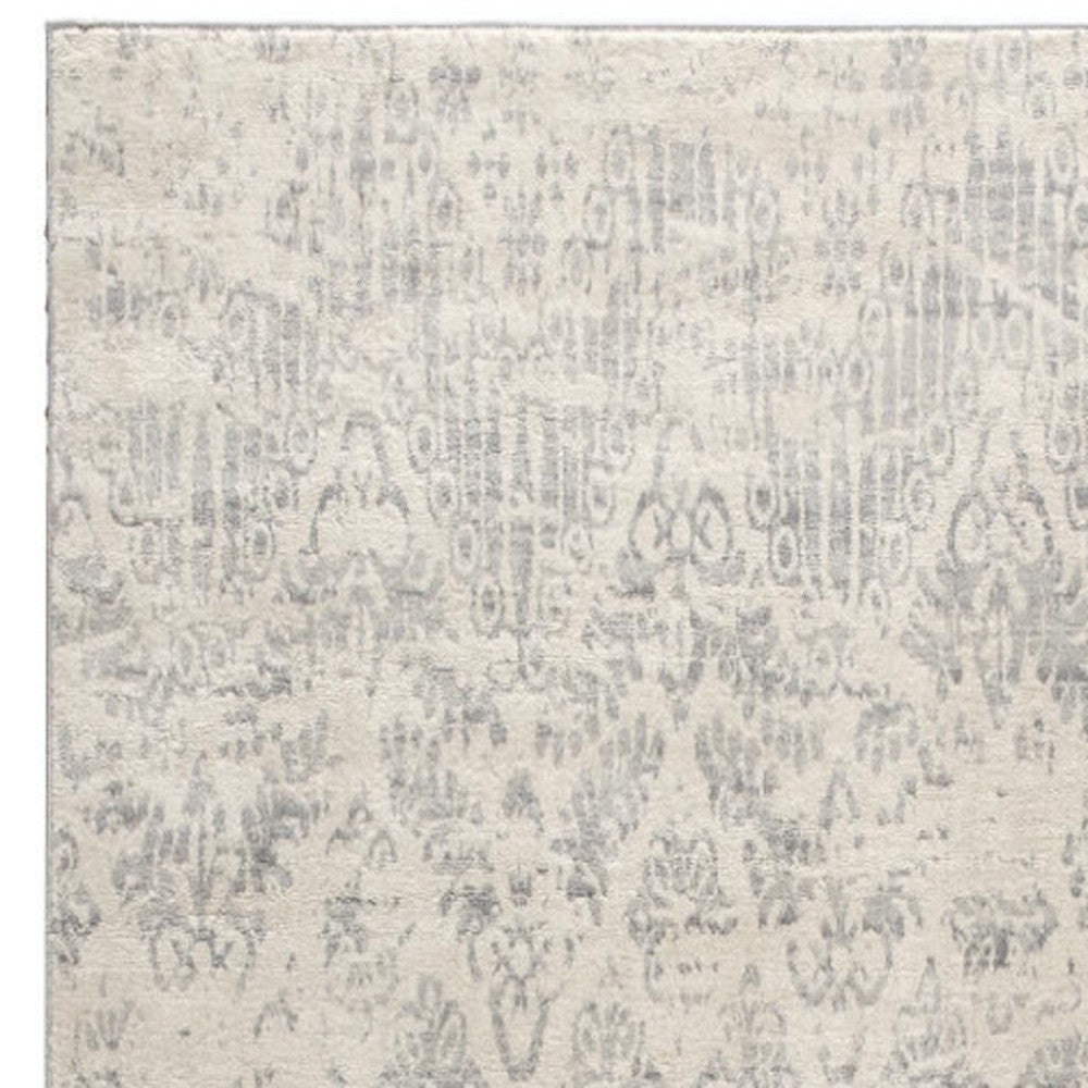 2' X 5' Ivory and Gray Ikat Power Loom Distressed Area Rug