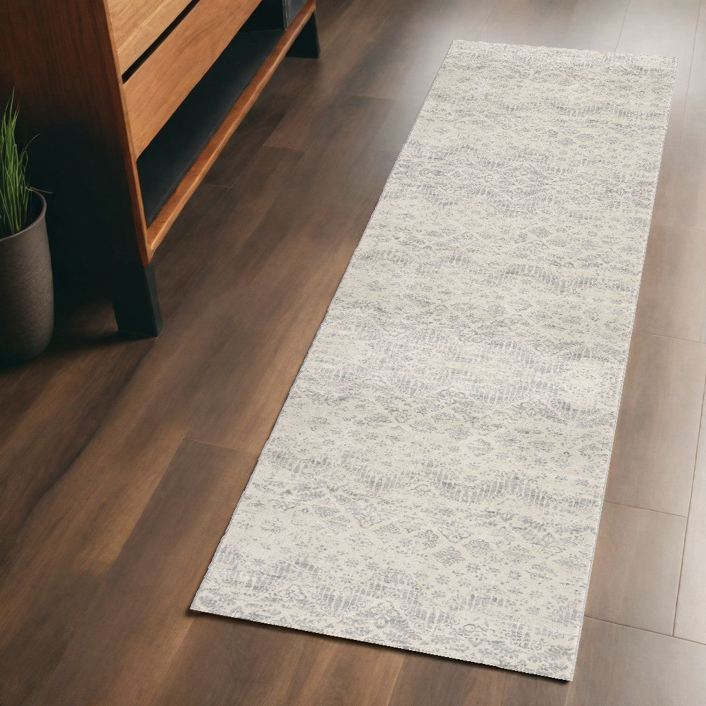 2' X 5' Ivory and Gray Ikat Power Loom Distressed Area Rug