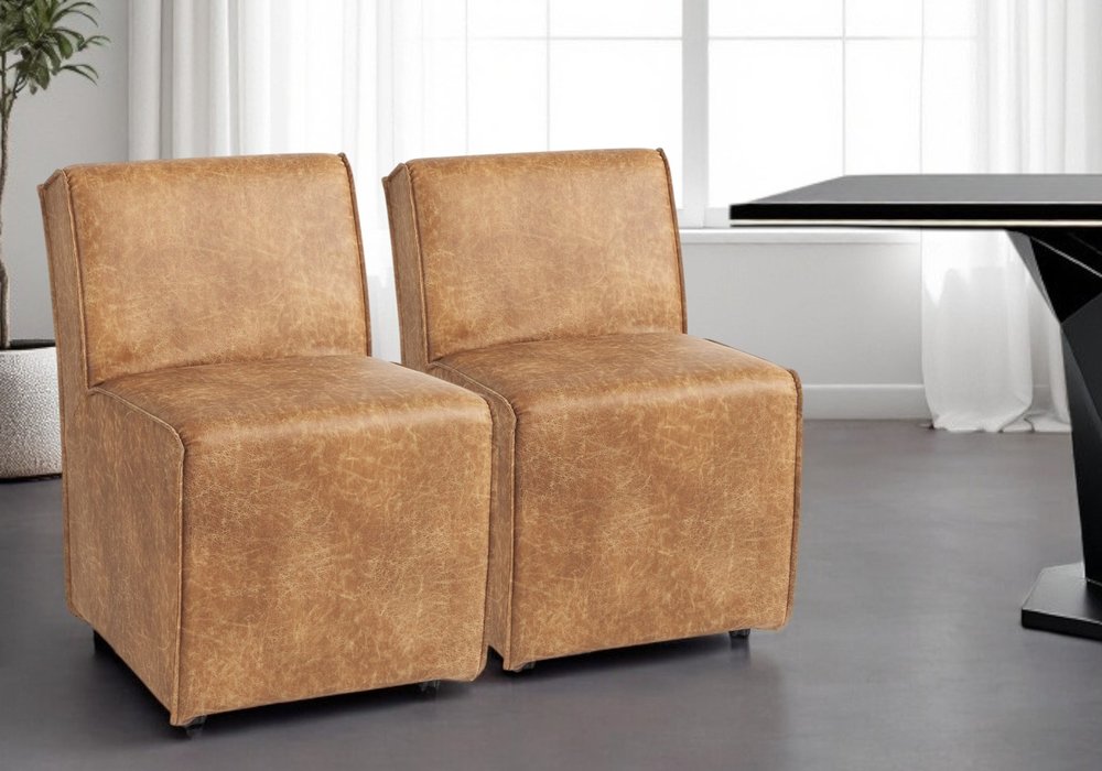 Set of Two Brown Upholstered Faux Leather Dining Side Chairs With Wheels