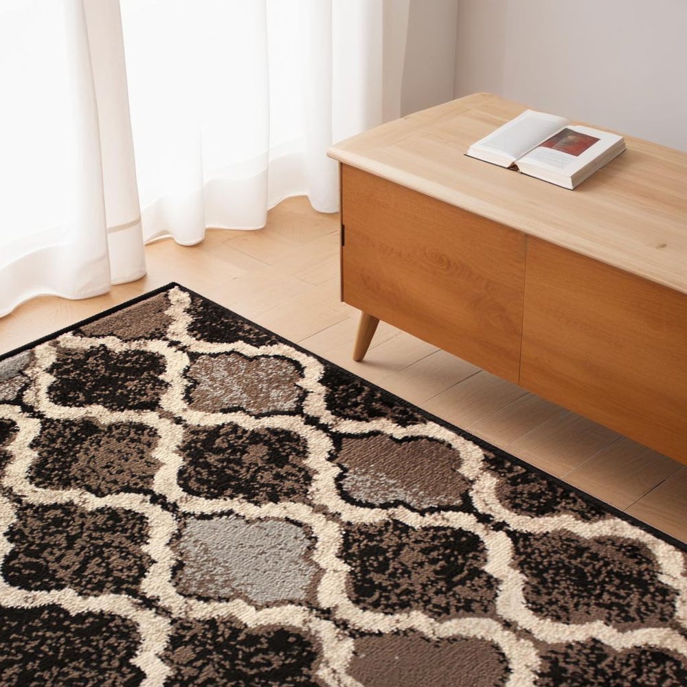 4' X 6' Brown Black And Ivory Quatrefoil Distressed Area Rug
