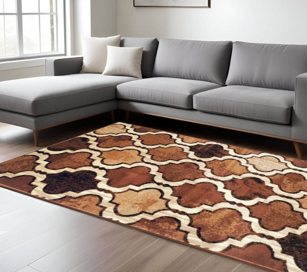 5' X 8' Brown And Ivory Quatrefoil Distressed Area Rug