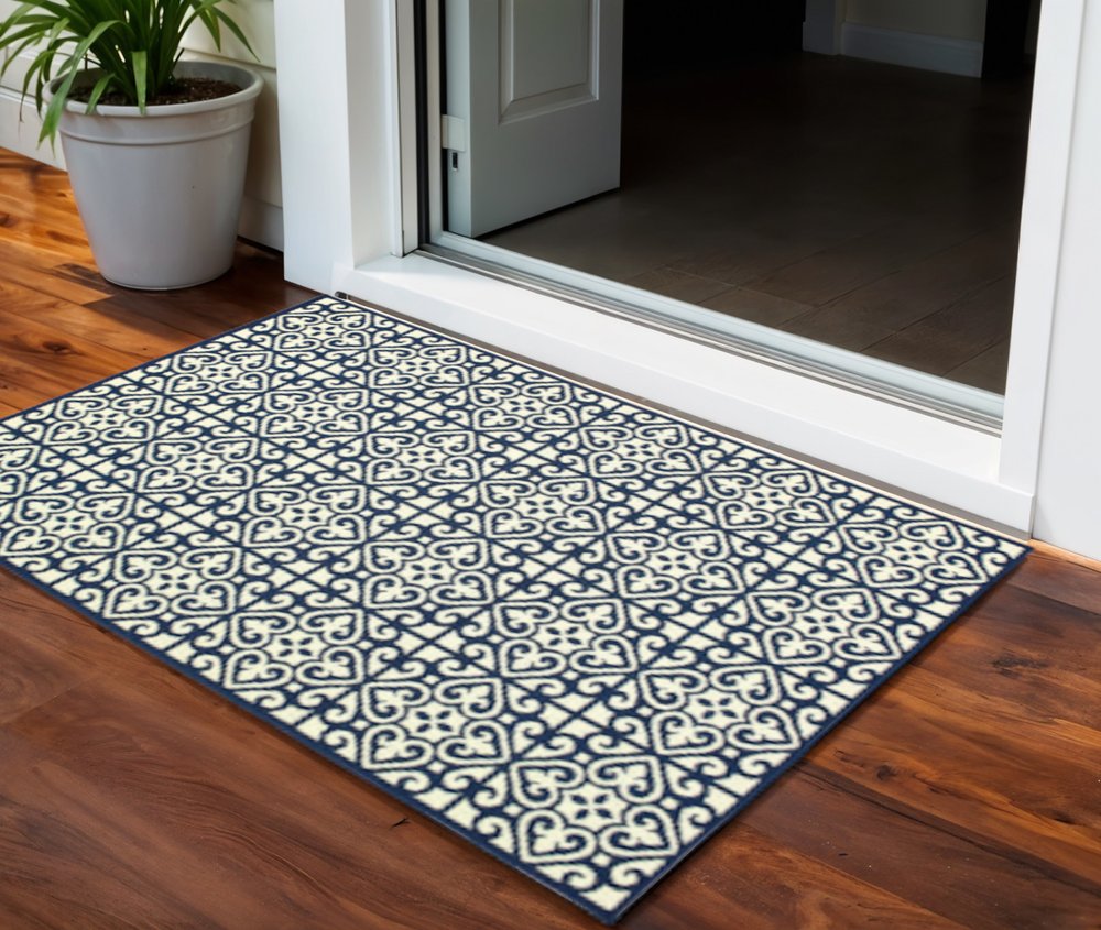 2' X 4' Ivory and Blue Geometric Stain Resistant Indoor Outdoor Area Rug