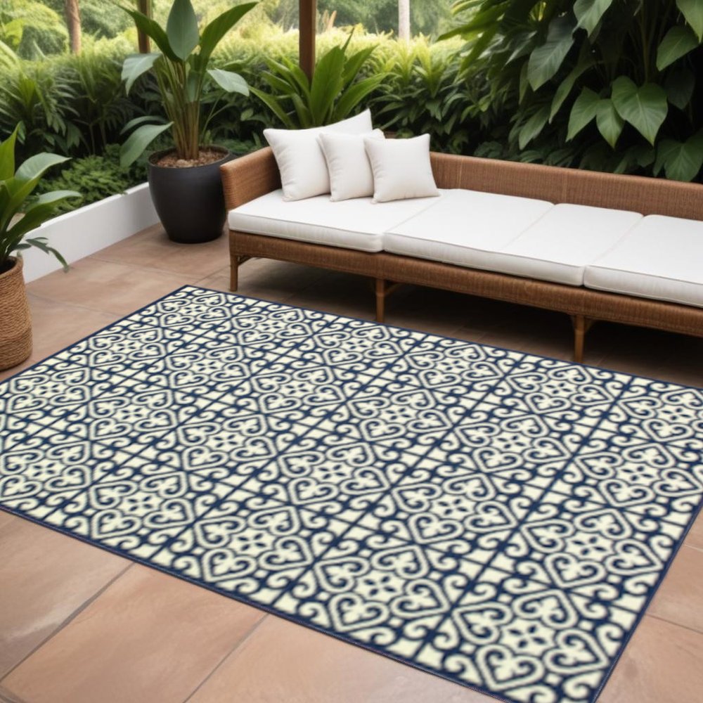 9' X 13' Ivory and Blue Geometric Stain Resistant Indoor Outdoor Area Rug