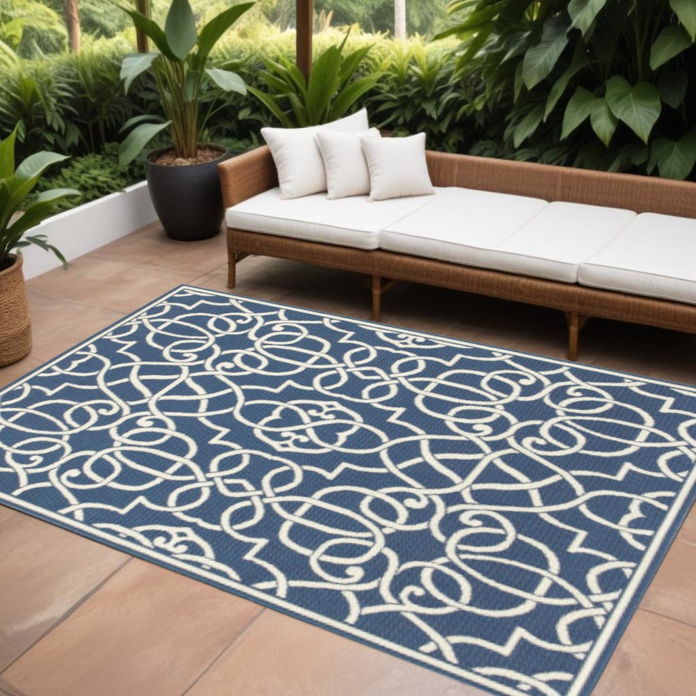7' X 10' Blue and Ivory Geometric Stain Resistant Indoor Outdoor Area Rug