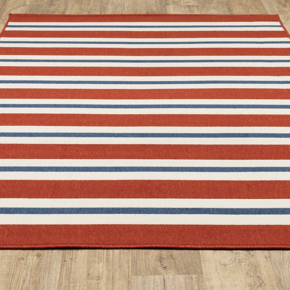 5' X 8' Red and Ivory Geometric Stain Resistant Indoor Outdoor Area Rug