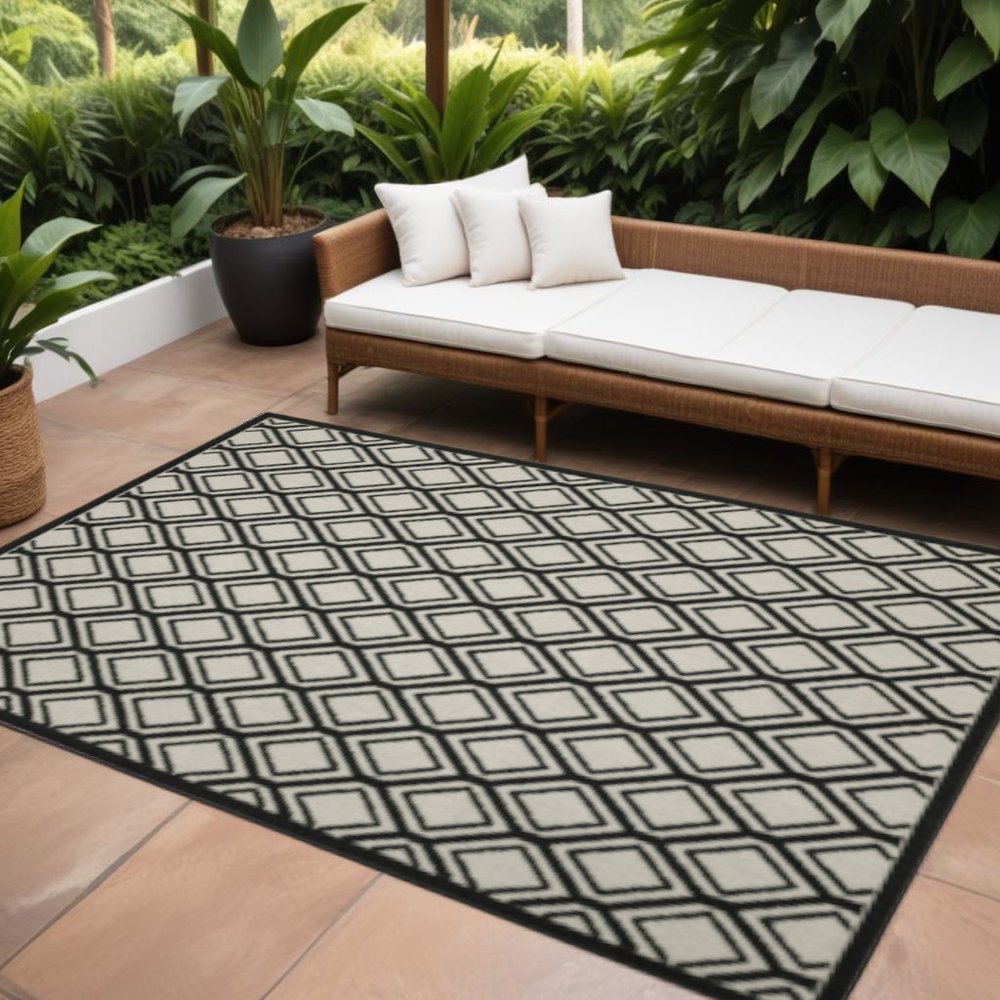 7' X 9' Beige and Black Geometric Stain Resistant Indoor Outdoor Area Rug