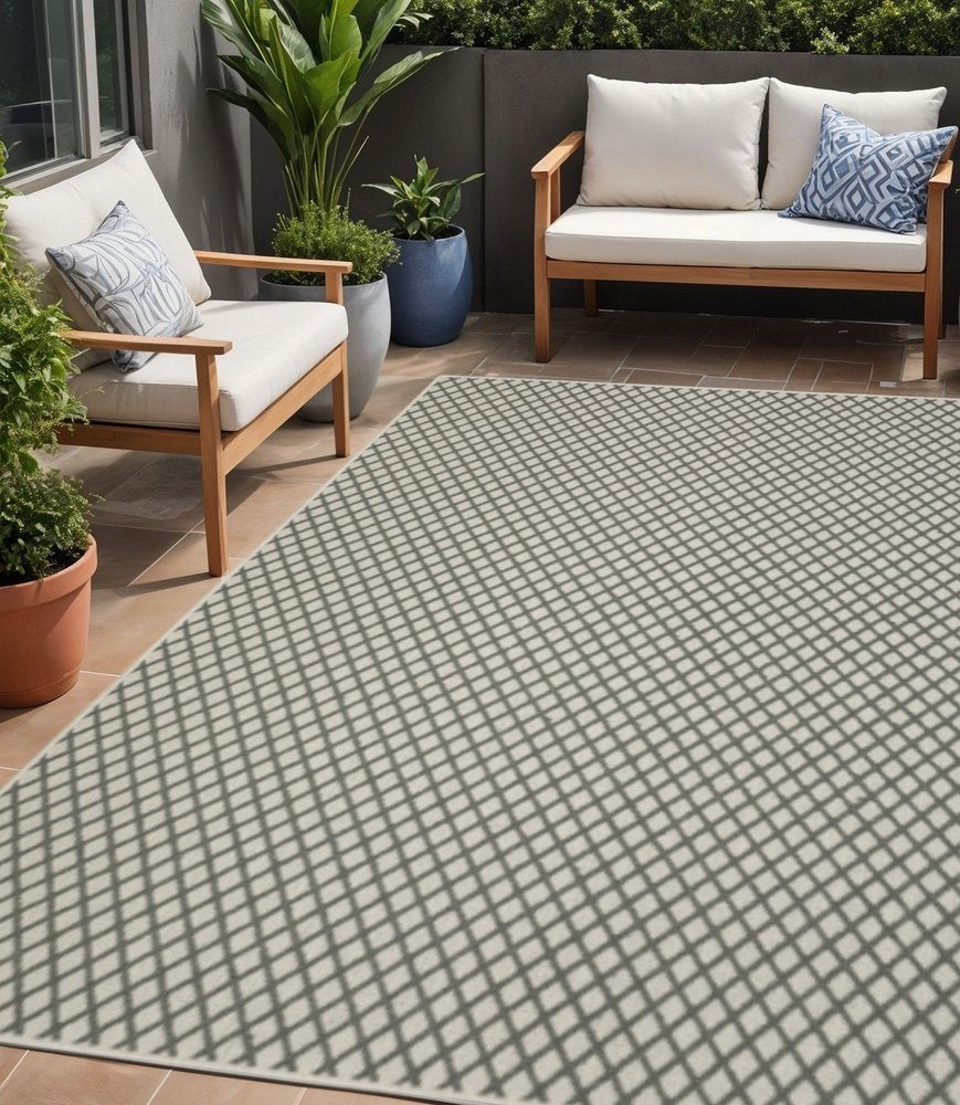 5' X 7' Beige Geometric Stain Resistant Indoor Outdoor Area Rug