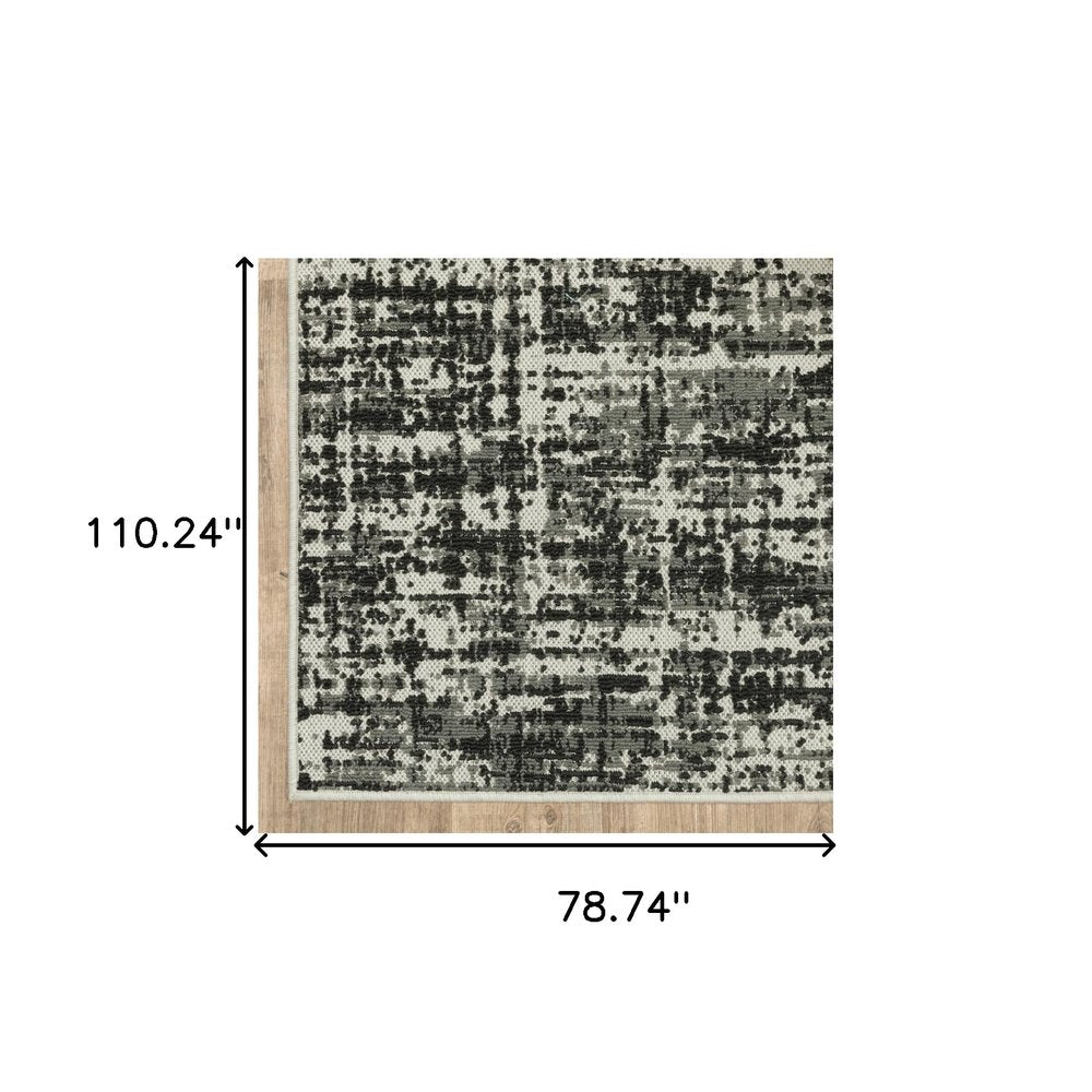 7' X 9' Beige and Black Abstract Stain Resistant Indoor Outdoor Area Rug