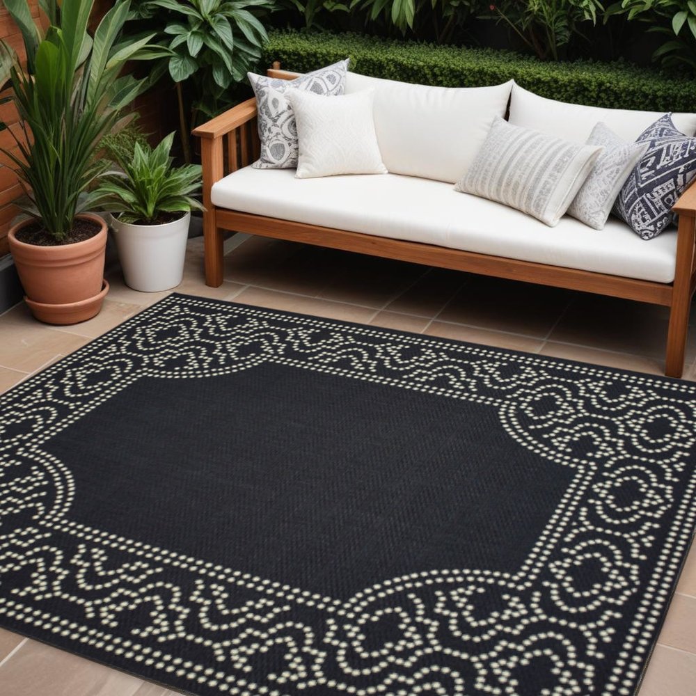 7' X 10' Black and Ivory Stain Resistant Indoor Outdoor Area Rug