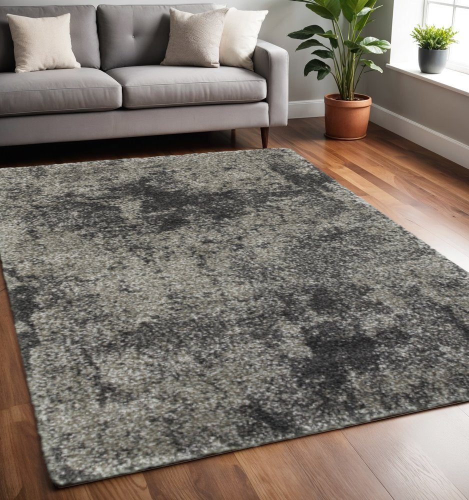 5' X 8' Black Silver and Gray Abstract Shag Power Loom Area Rug