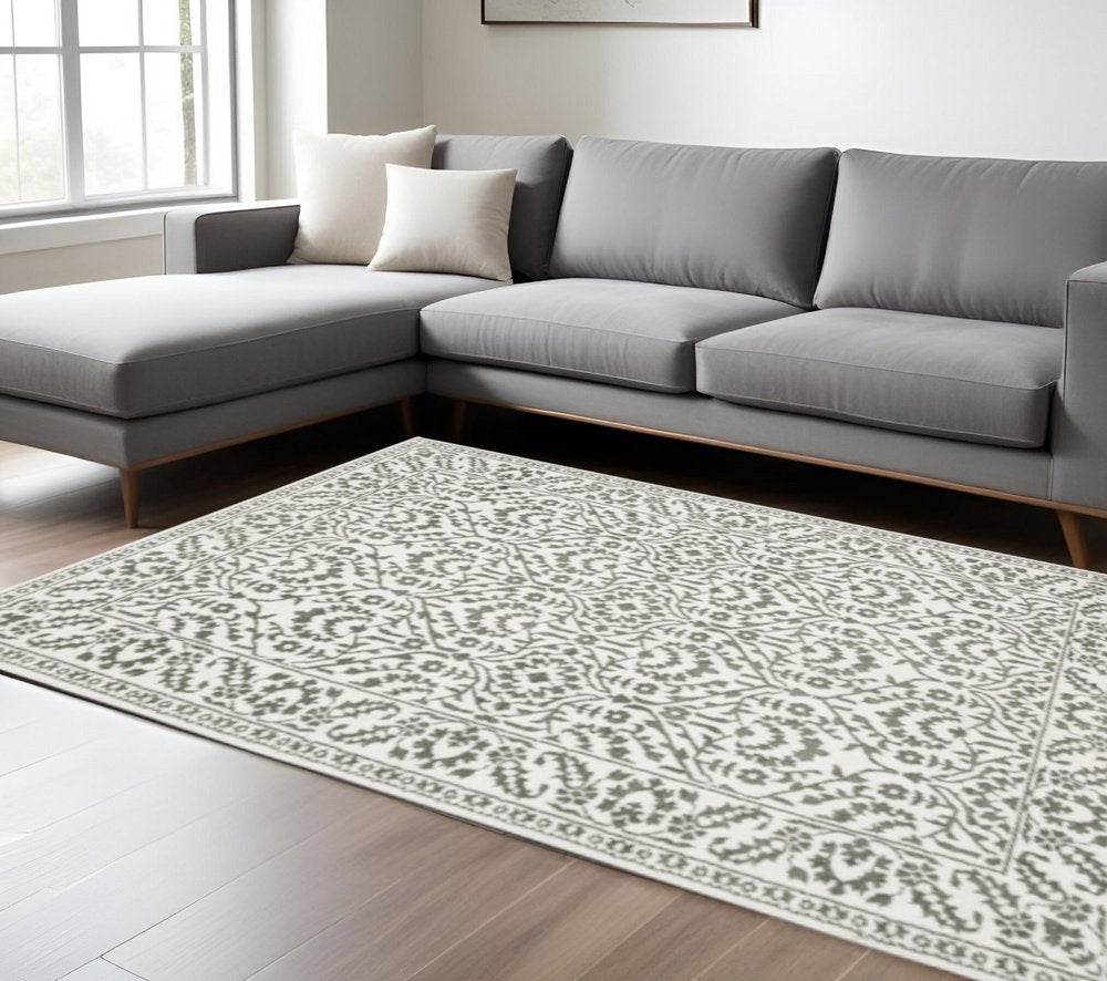 10' X 13' Grey And White Floral Power Loom Stain Resistant Area Rug