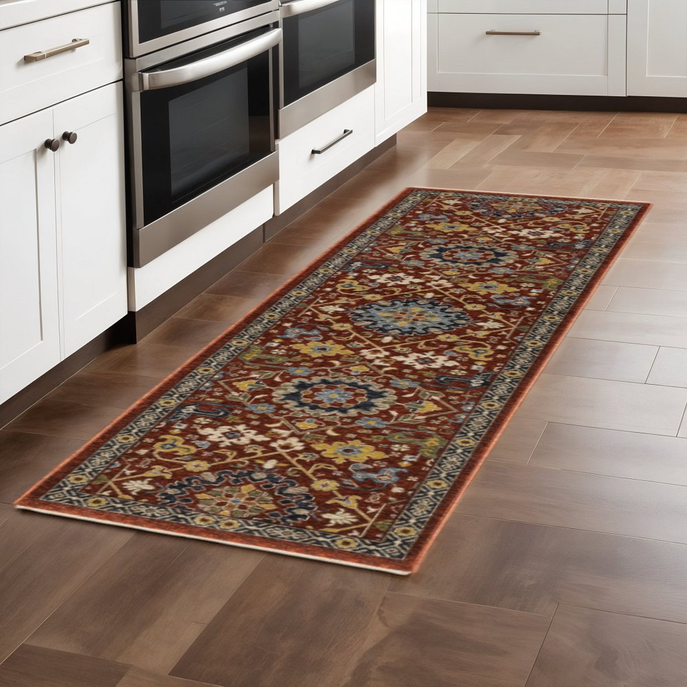 2' X 8' Red Blue Gold And Ivory Oriental Power Loom Stain Resistant Runner Rug With Fringe