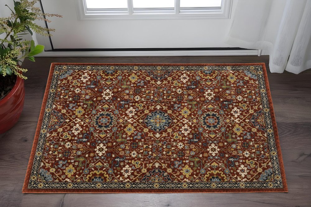 3' X 5' Red Blue Gold And Ivory Oriental Power Loom Stain Resistant Area Rug With Fringe