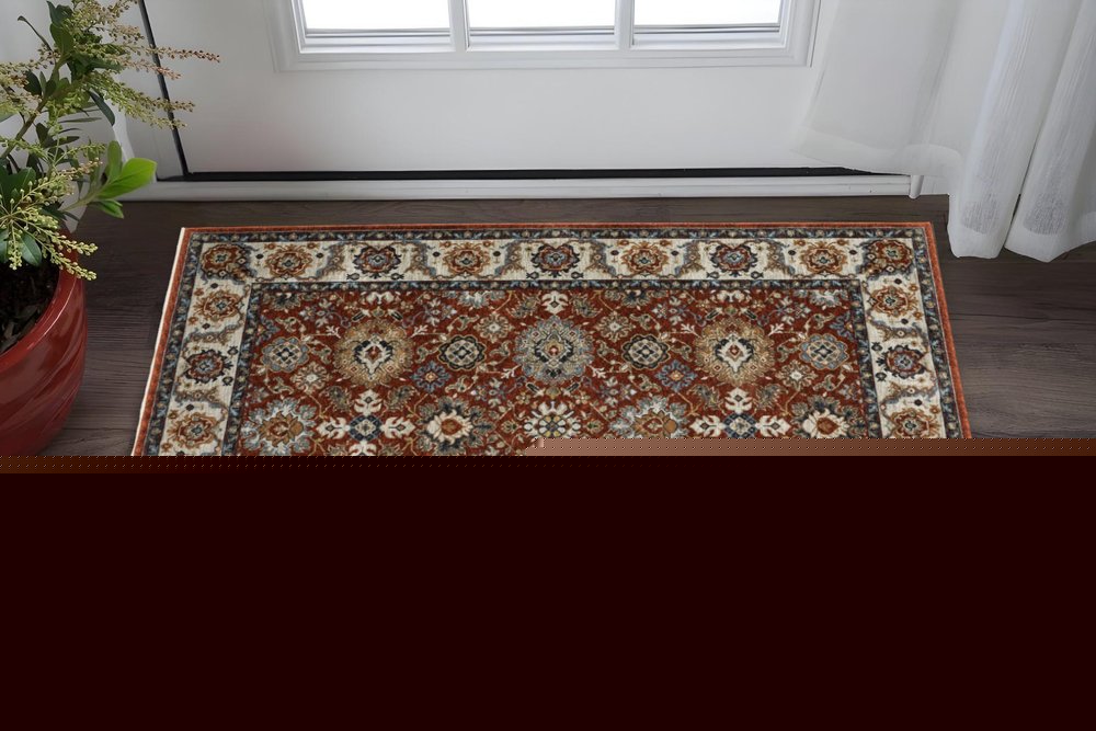 2' X 3' Red Blue Ivory Gold And Navy Oriental Power Loom Stain Resistant Area Rug With Fringe