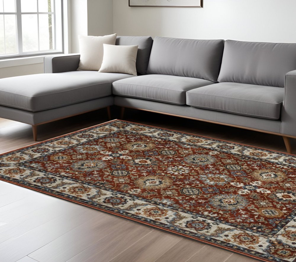 8' X 11' Red Ivory And Orange Oriental Area Rug With Fringe