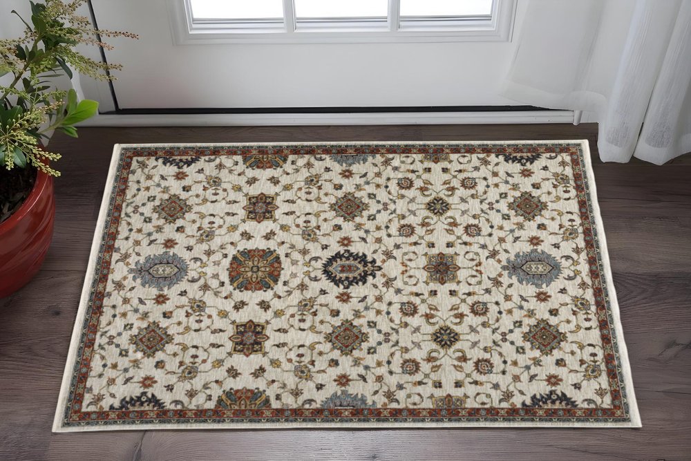 2' X 3' Ivory Grey Rust Red Gold And Shades Of Blue Oriental Power Loom Stain Resistant Area Rug With Fringe