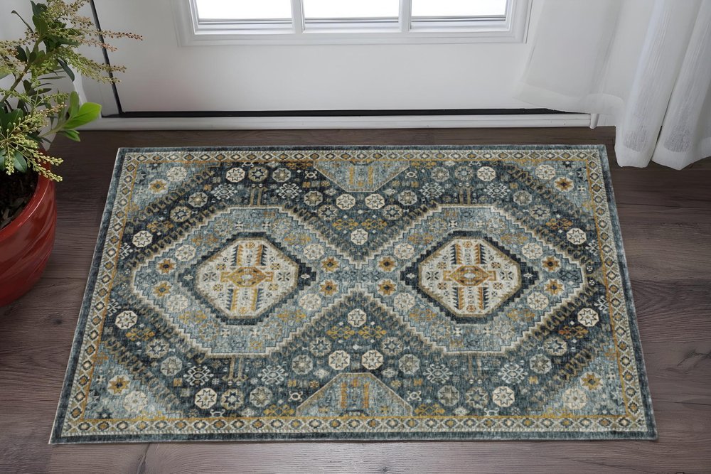 3' X 5' Blue Gold Ivory And Navy Oriental Power Loom Stain Resistant Area Rug With Fringe