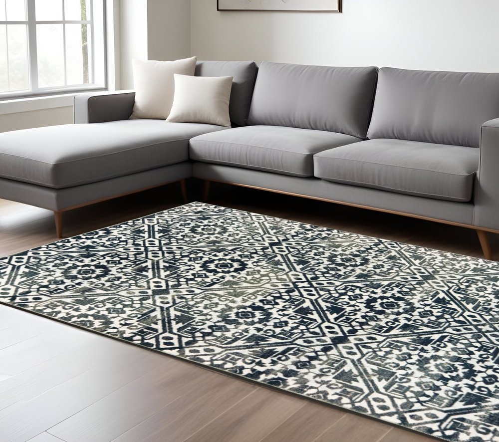 7' X 10' Navy Blue And Ivory Geometric Distressed Area Rug