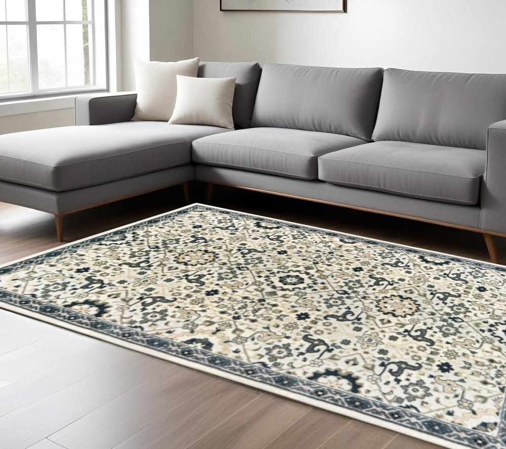 10' X 13' Ivory Navy And Gold Oriental Power Loom Stain Resistant Area Rug