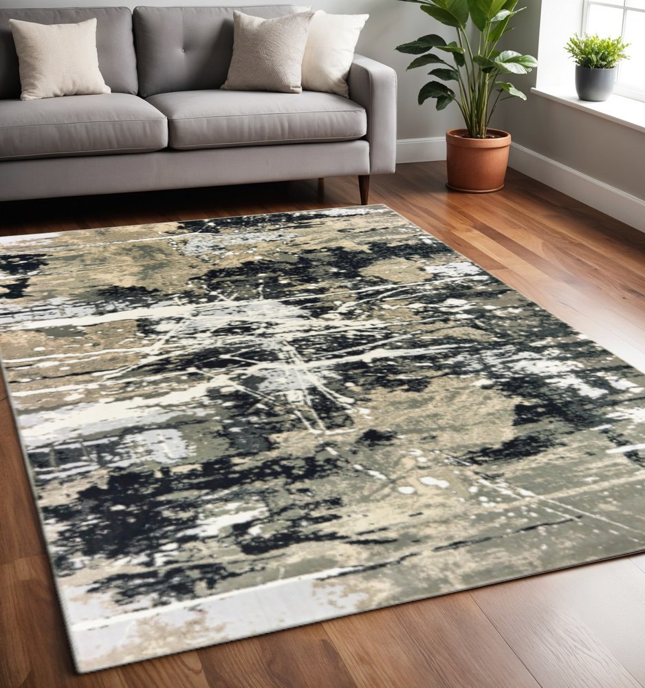 5' X 8' Black Gold Grey And Ivory Abstract Power Loom Stain Resistant Area Rug
