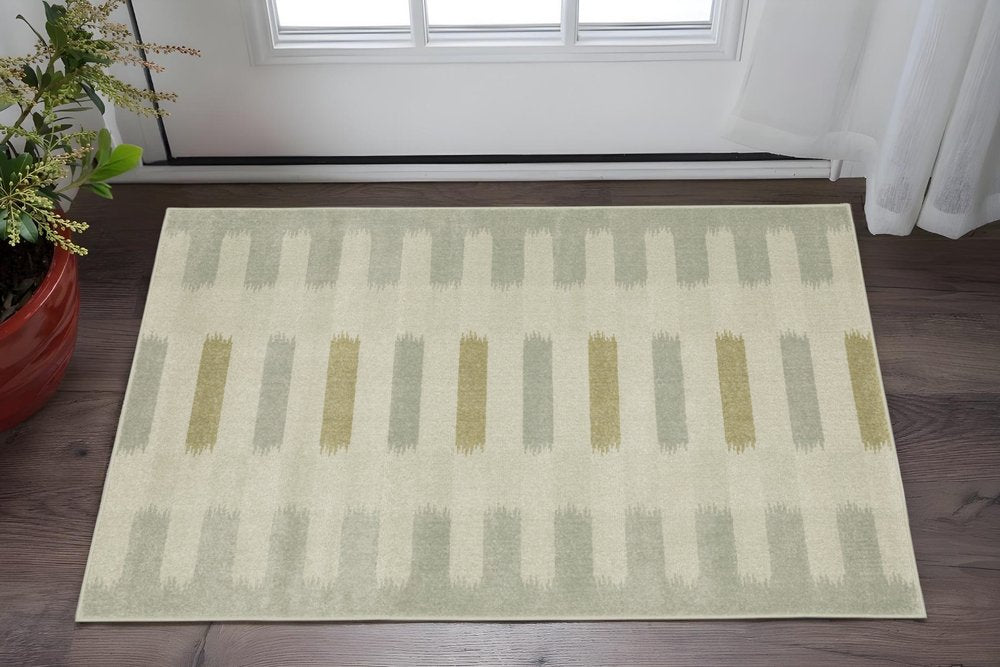 3' X 5' Beige Grey Gold And Green Geometric Power Loom Stain Resistant Area Rug