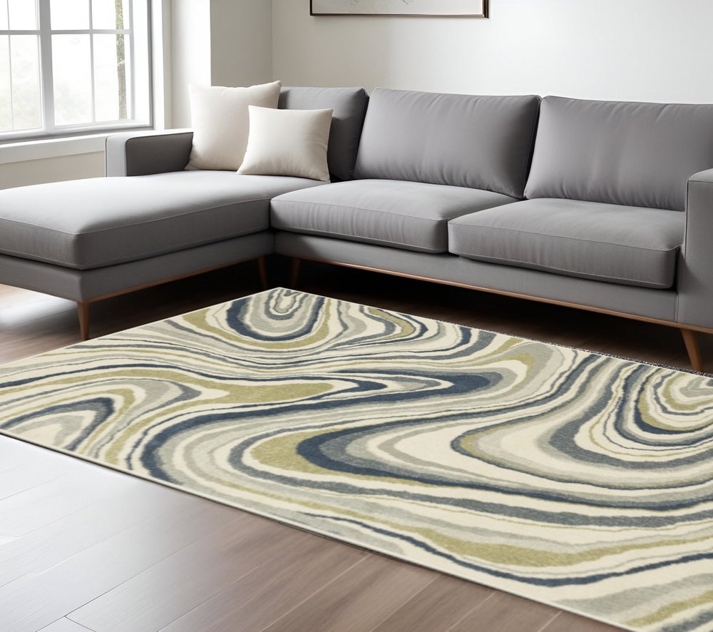7' X 9' Ivory And Blue Abstract Area Rug