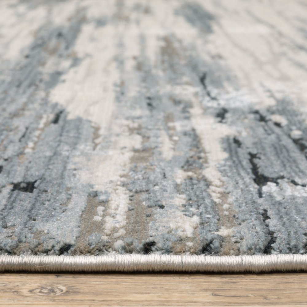 8' X 11' Blue Grey Beige And Brown Abstract Power Loom Stain Resistant Area Rug