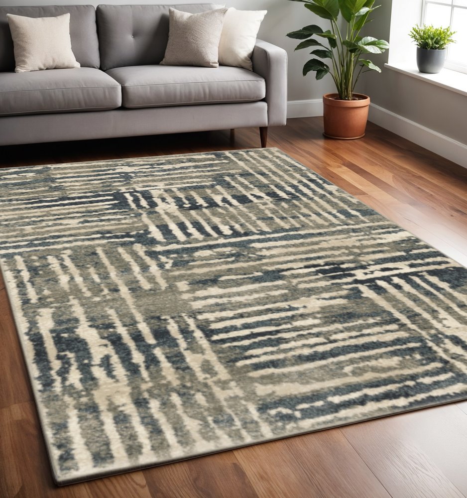 5' X 7' Blue And Beige Abstract Power Loom Stain Resistant Area Rug