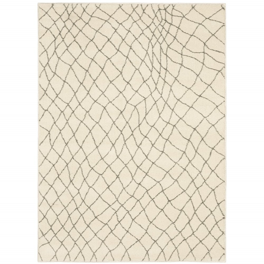 5' X 7' Ivory And Grey Geometric Power Loom Stain Resistant Area Rug