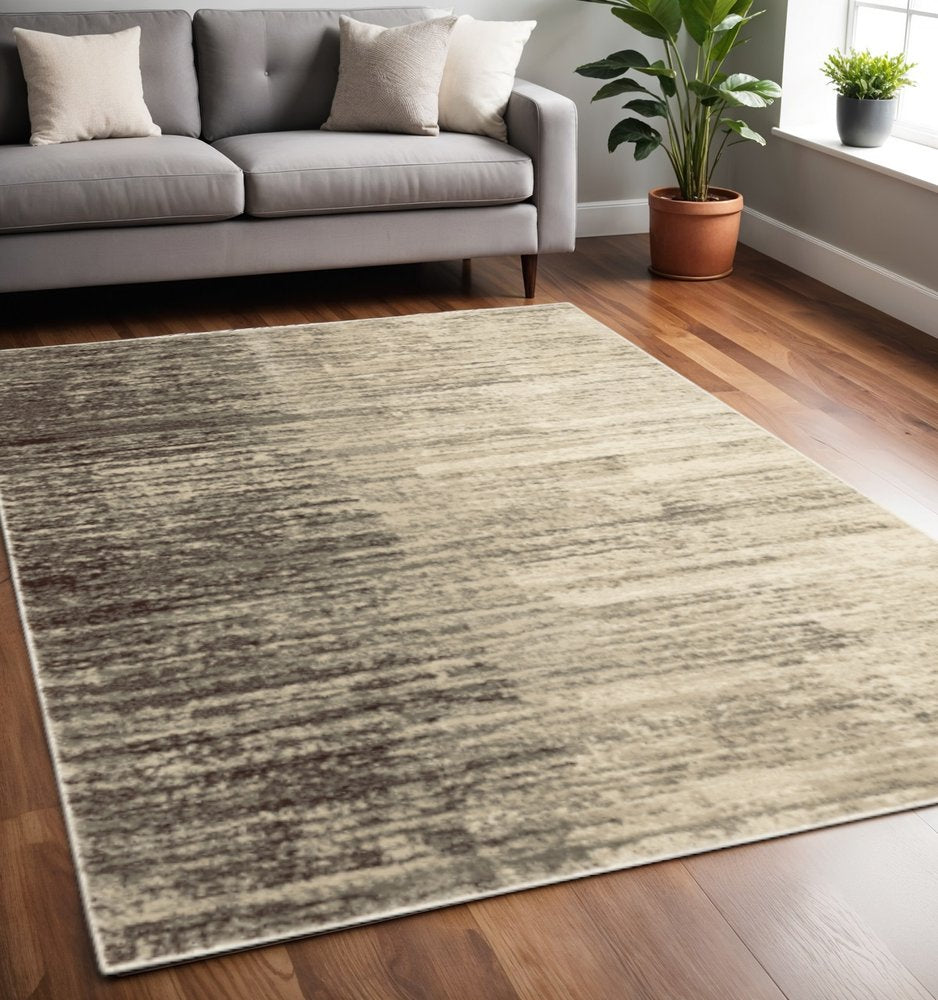 5' X 7' Beige And Grey Abstract Power Loom Stain Resistant Area Rug