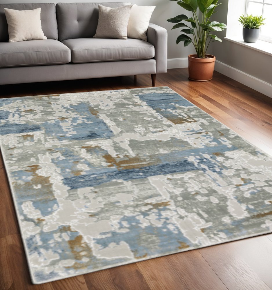 5' X 8' Grey Blue Navy Ivory And Brown Abstract Power Loom Stain Resistant Area Rug