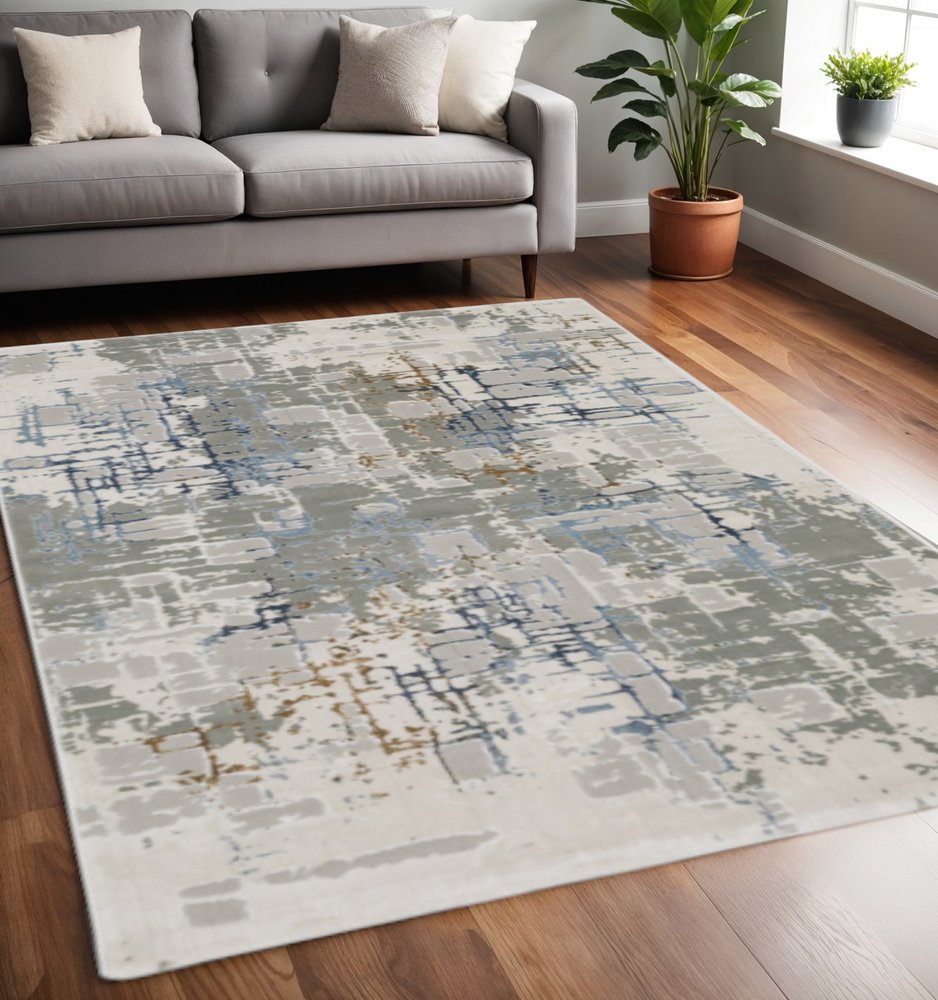 5' X 8' Grey Blue Brown Ivory And Deep Blue Abstract Power Loom Stain Resistant Area Rug