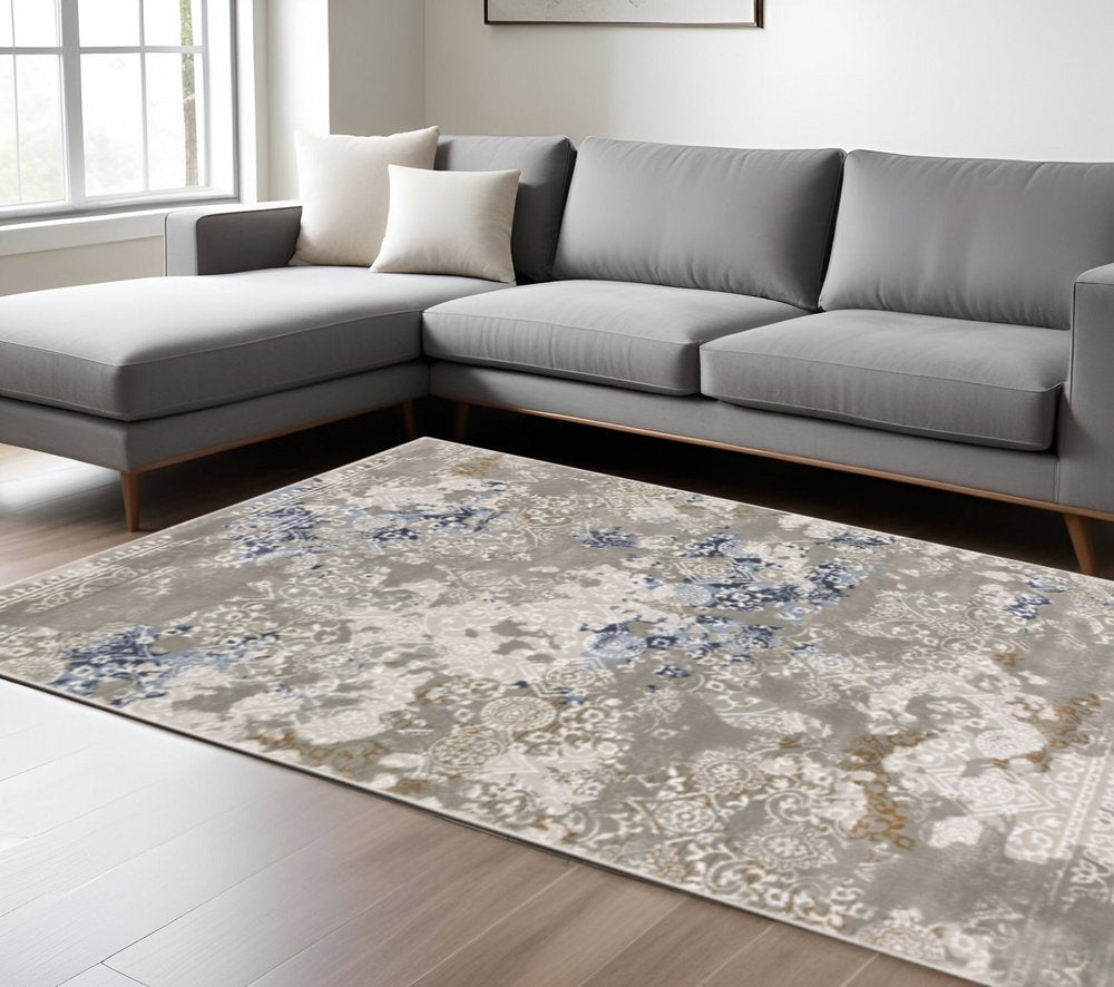 6' X 9' Grey Blue Ivory Brown And Navy Abstract Power Loom Stain Resistant Area Rug