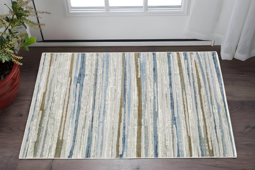 3' X 5' Grey Blue Ivory Brown Beige And Navy Abstract Power Loom Stain Resistant Area Rug