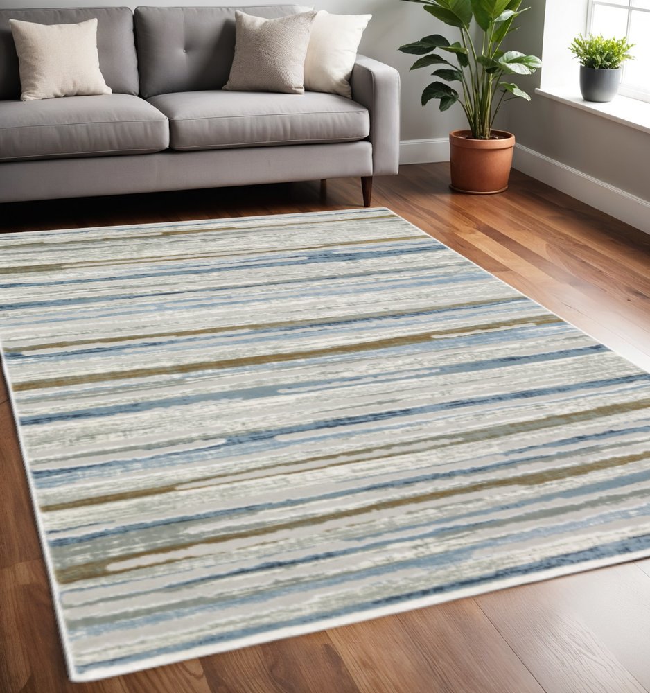 5' X 8' Grey Blue Ivory Brown Beige And Navy Abstract Power Loom Stain Resistant Area Rug
