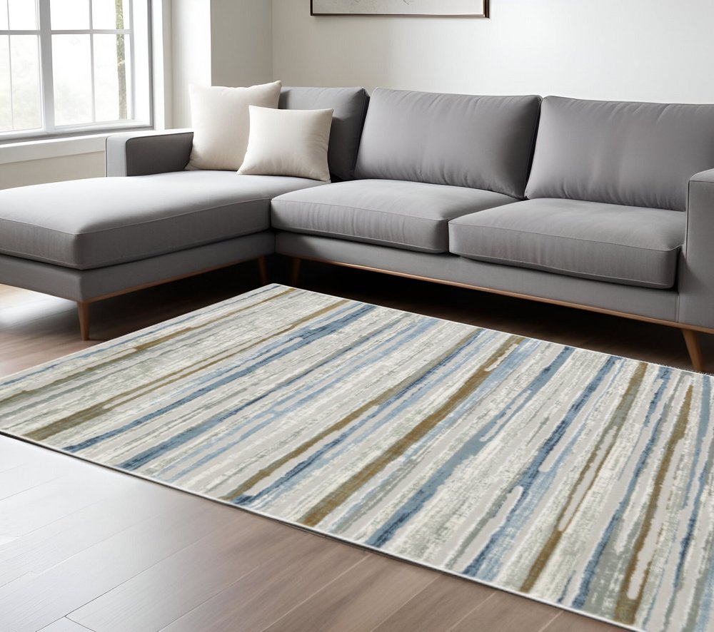 6' X 9' Grey Blue Ivory Brown Beige And Navy Abstract Power Loom Stain Resistant Area Rug