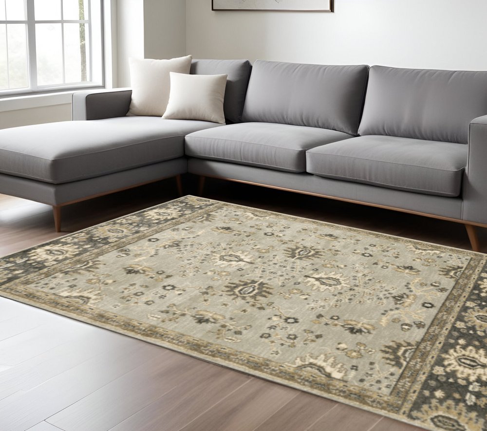 6' X 9' Grey Brown Tan And Beige Oriental Power Loom Stain Resistant Area Rug