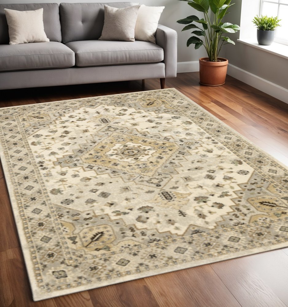 5' X 8' Beige Grey Tan And Brown Oriental Power Loom Stain Resistant Area Rug