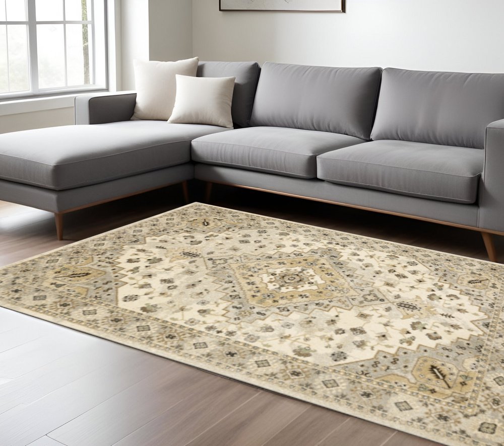 6' X 9' Beige Grey Tan And Brown Oriental Power Loom Stain Resistant Area Rug