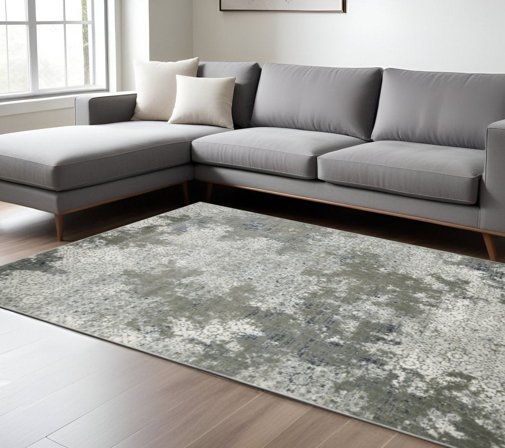 10' X 13' Ivory Grey Blue And Taupe Abstract Power Loom Stain Resistant Area Rug