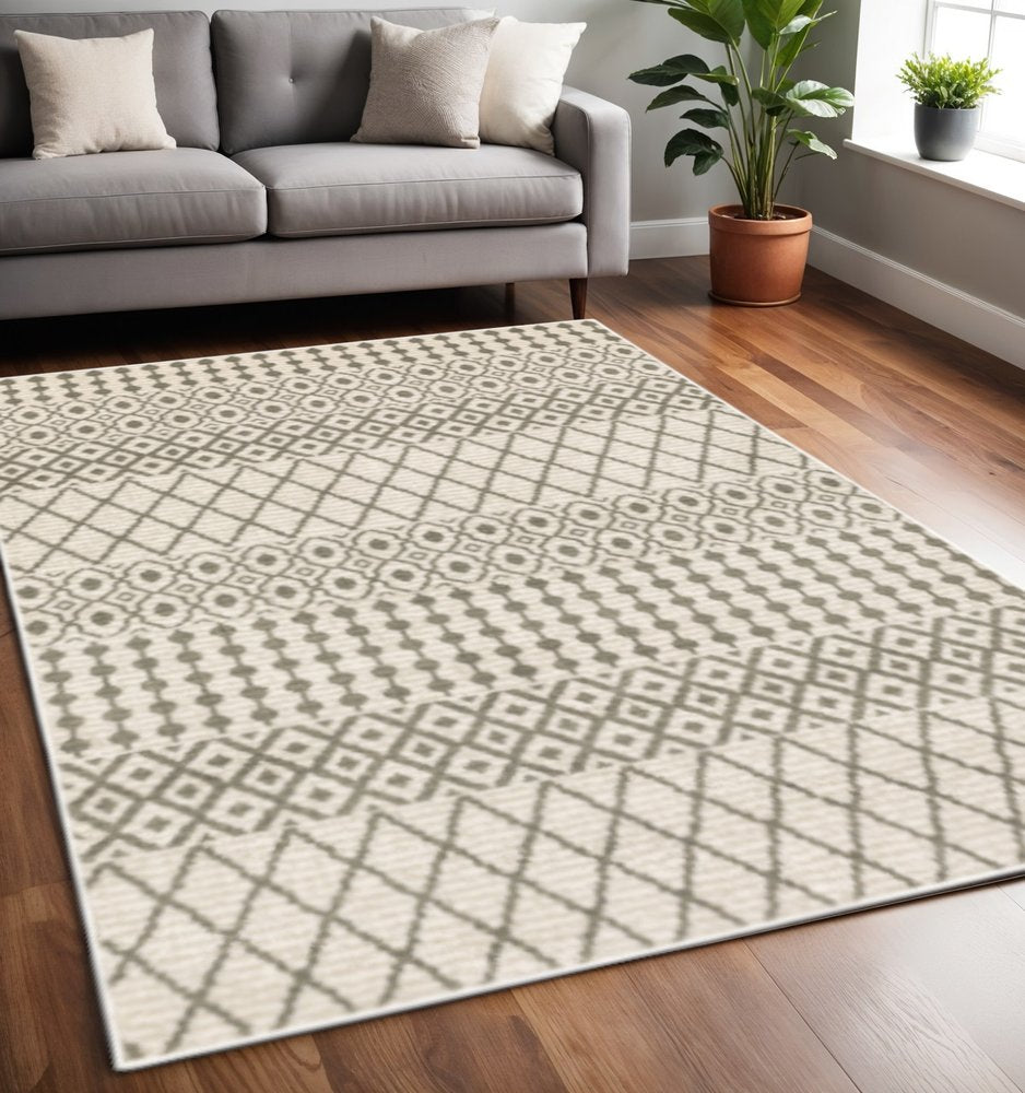 5' X 7' Ivory And Grey Geometric Power Loom Stain Resistant Area Rug